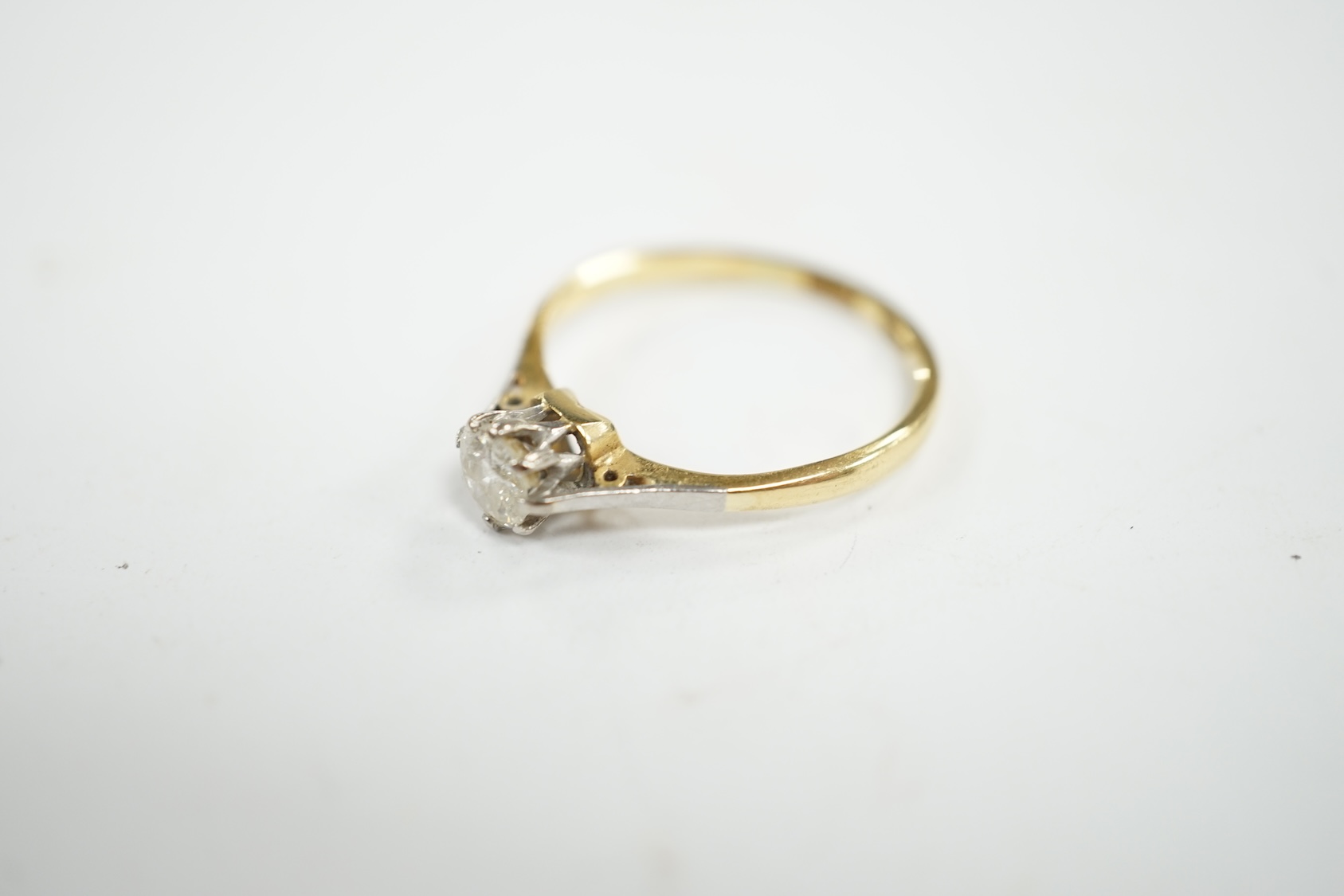 An 18ct and solitaire diamond ring, size O, gross weight 2.3 grams. Condition - fair